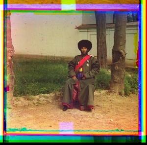 Isfandiyar, Khan of the Russian protectorate of Khorezm(Khiva), full-length portrait in uniform, seated on chair, outdoors.